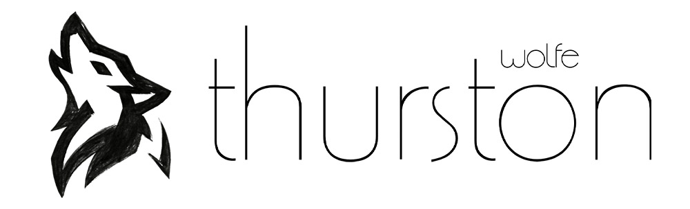 Thurston Wolfe logo with wolf silhouette