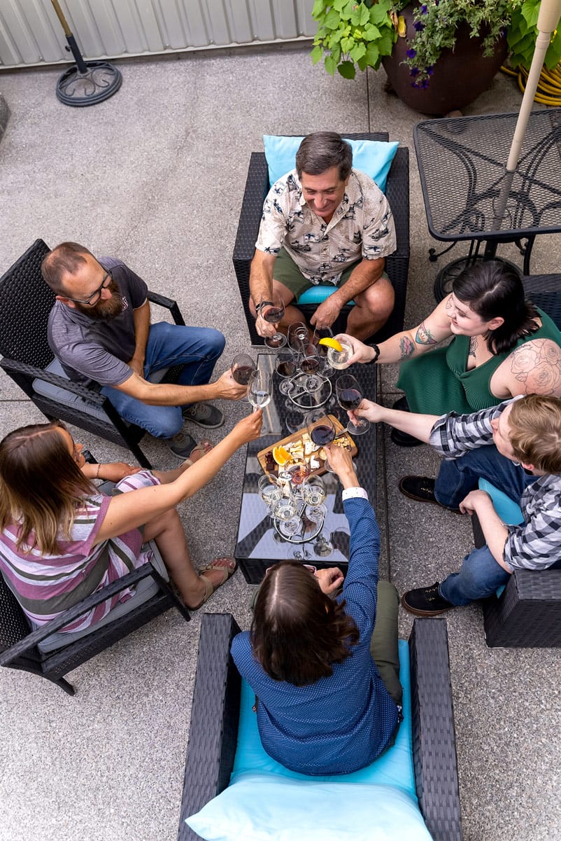 Group enjoying drinks on outdoor patio